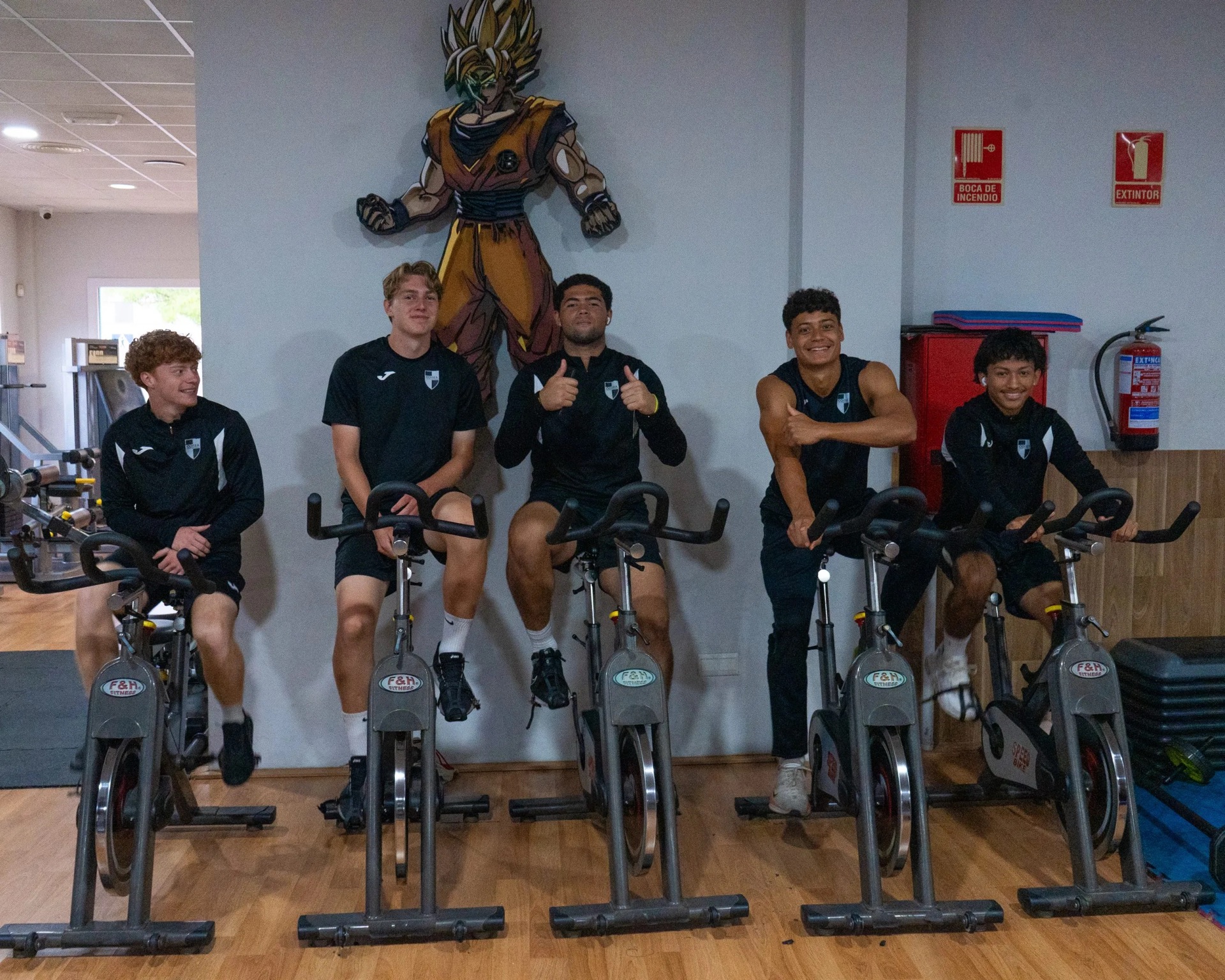Players on exercise bikes at the partner gym
